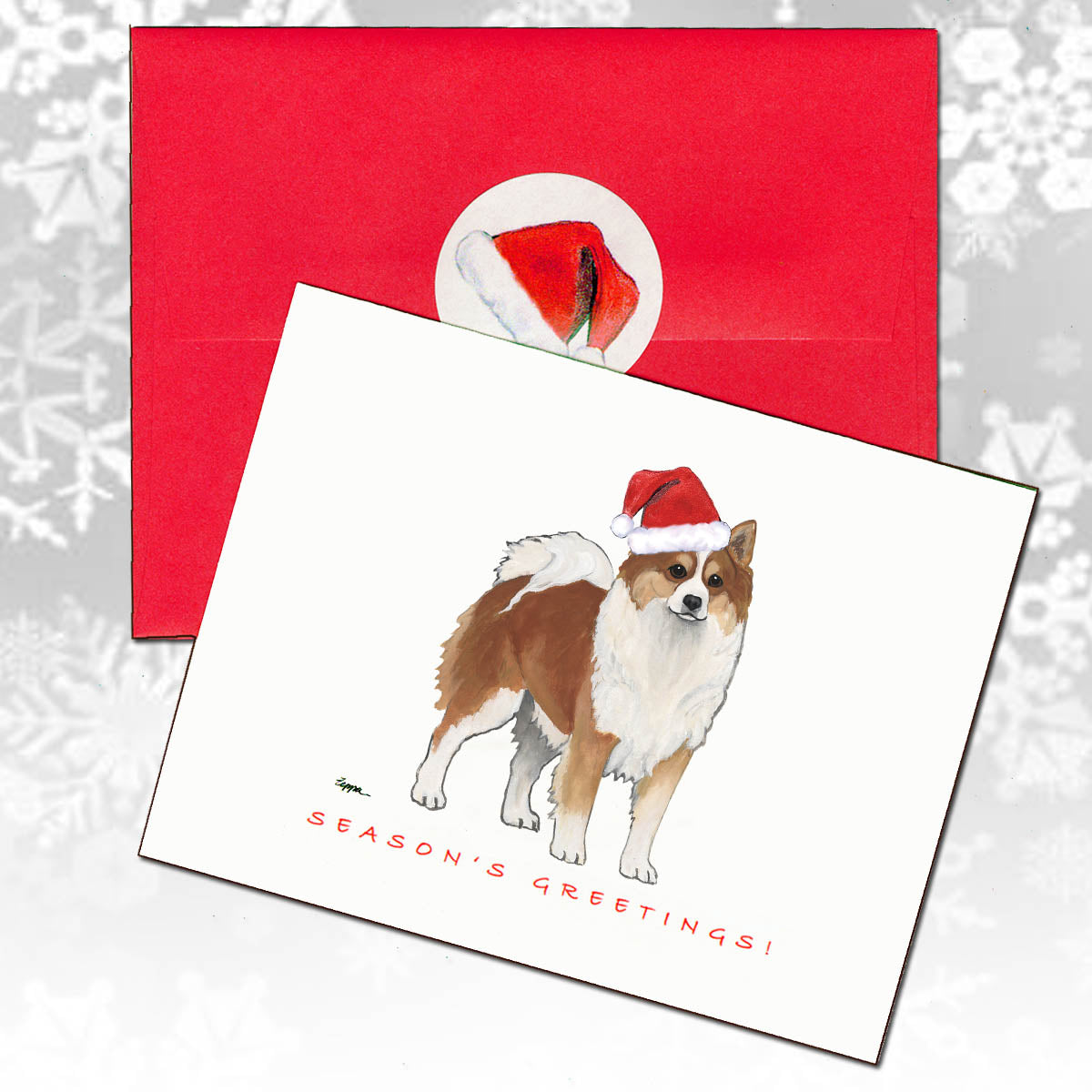 Christmas card with an Icelandic Sheepdog wearing a Santa hat and red envelope 