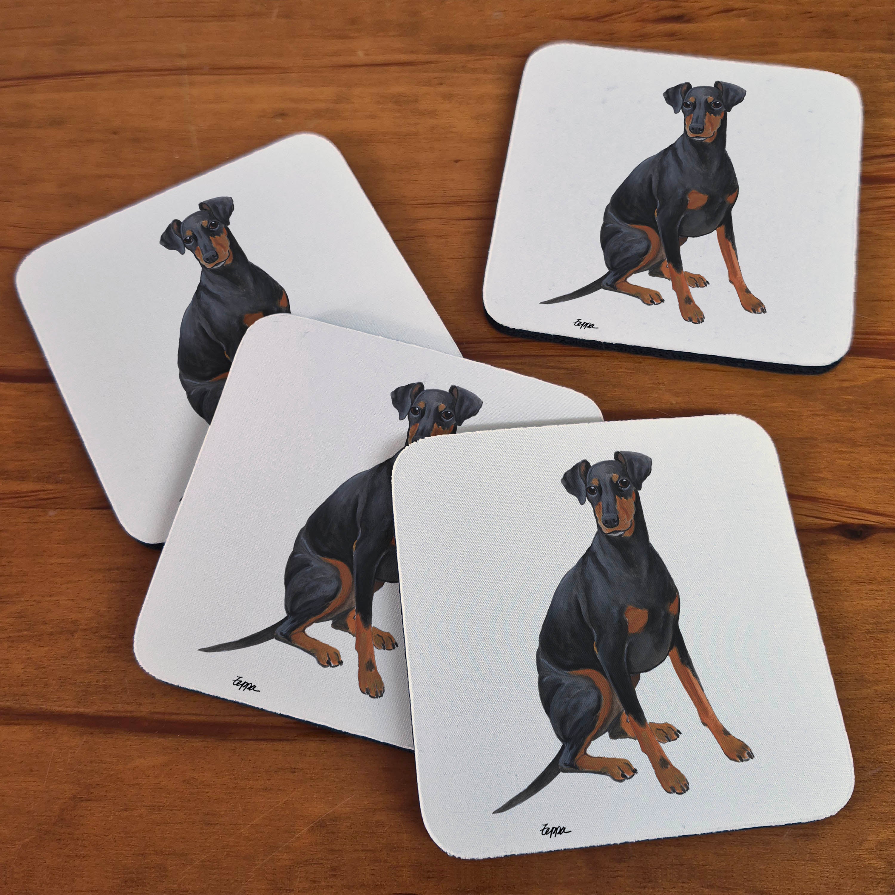 Manchester Terrier illustration on beige poly/rubber beverage coasters.