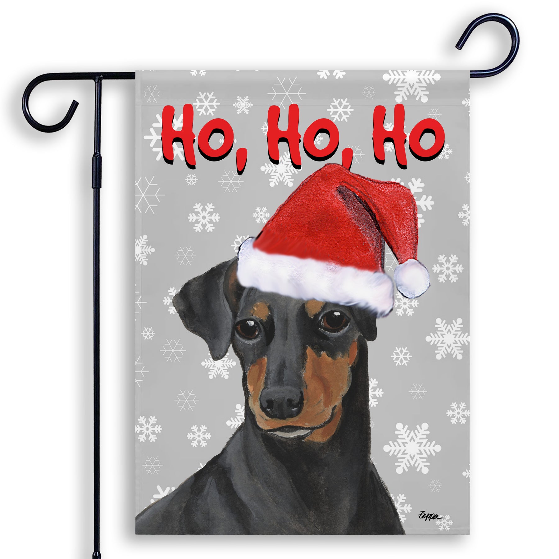 Manchester Terrier in a Santa Hat on a grey Ho Ho Ho garden flag.