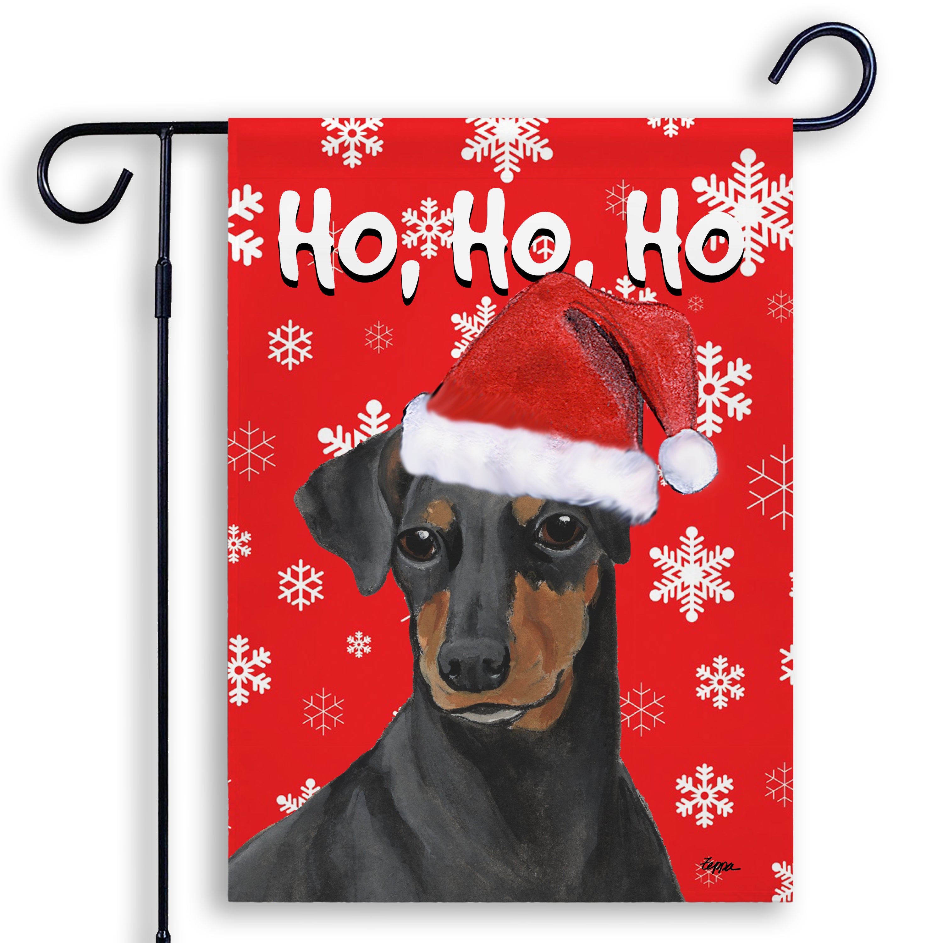 Manchester Terrier in a Santa Hat on a red Ho Ho Ho garden flag.