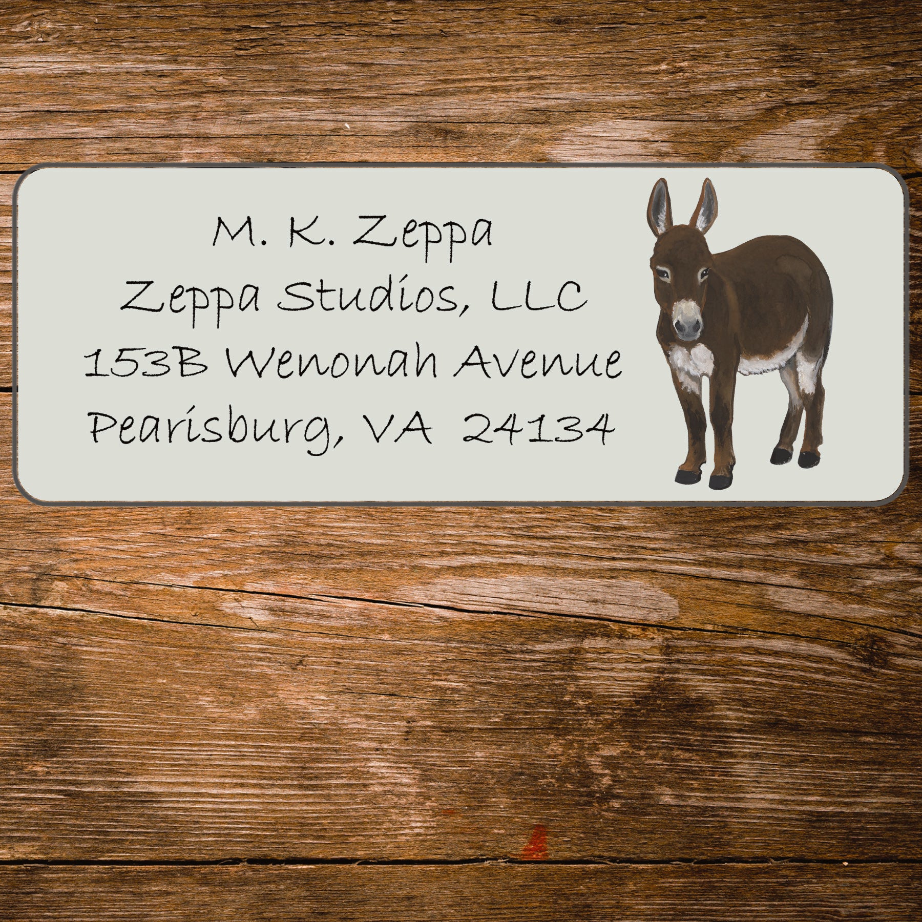 Ivory return address label with a Mini Donkey illustration.