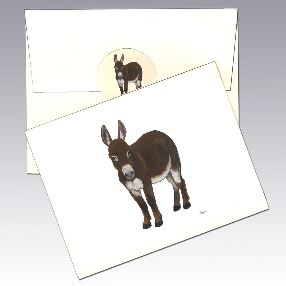 An ivory greeting card with an illustration of a brown mini donkey.