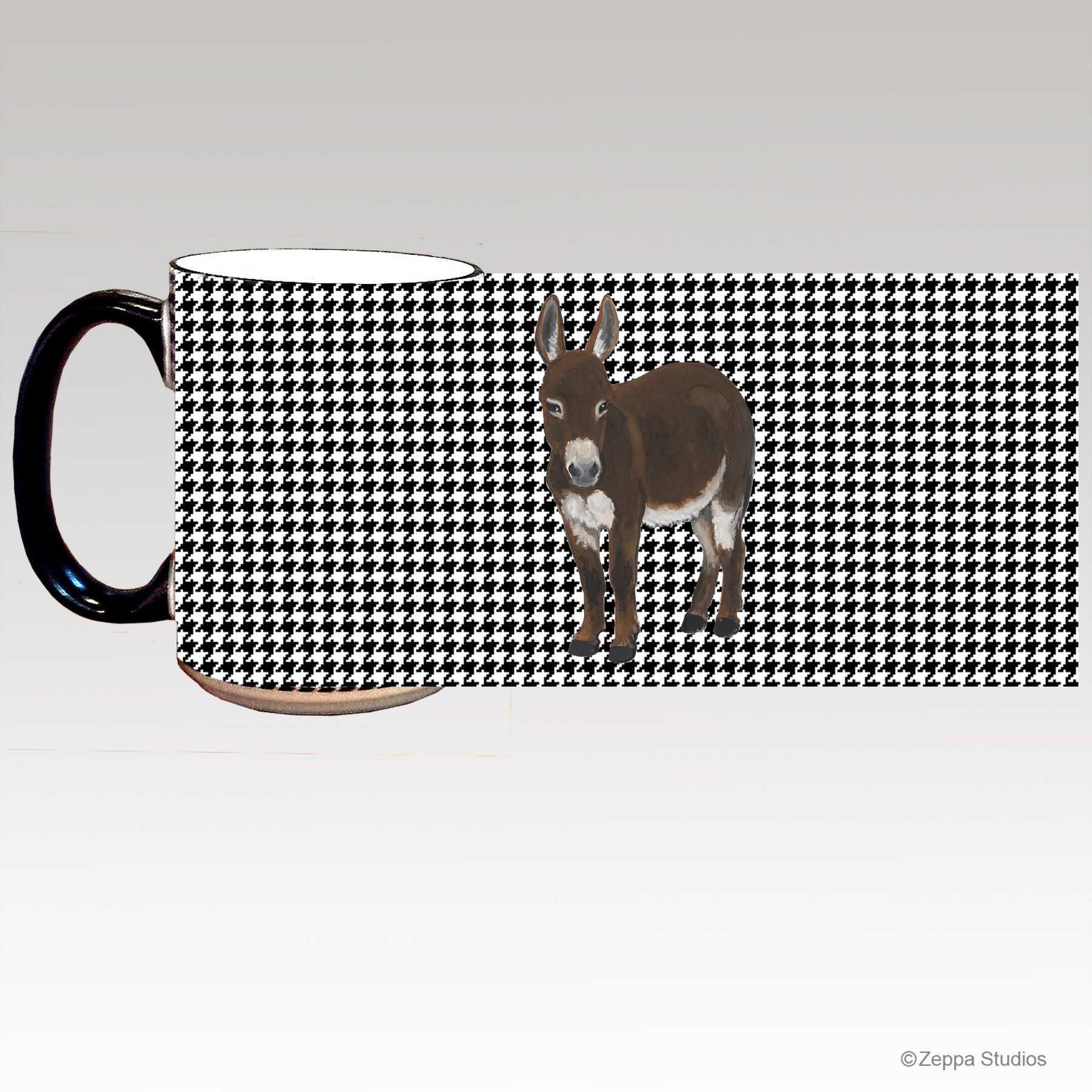 A ceramic mug with a black and white houndstooth wrap around  pattern and a brown mini donkey illustration in the center.