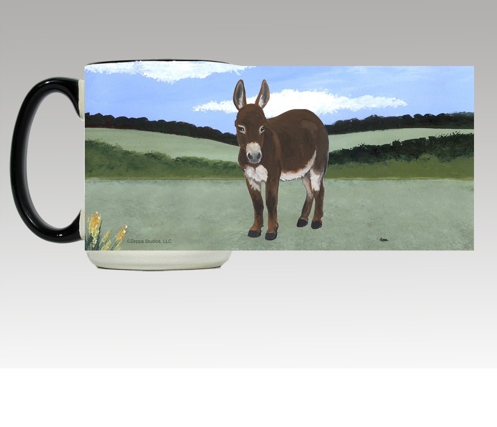 Wrap design for a white ceramic mug with black trim and handle of a mini donkey in a field.