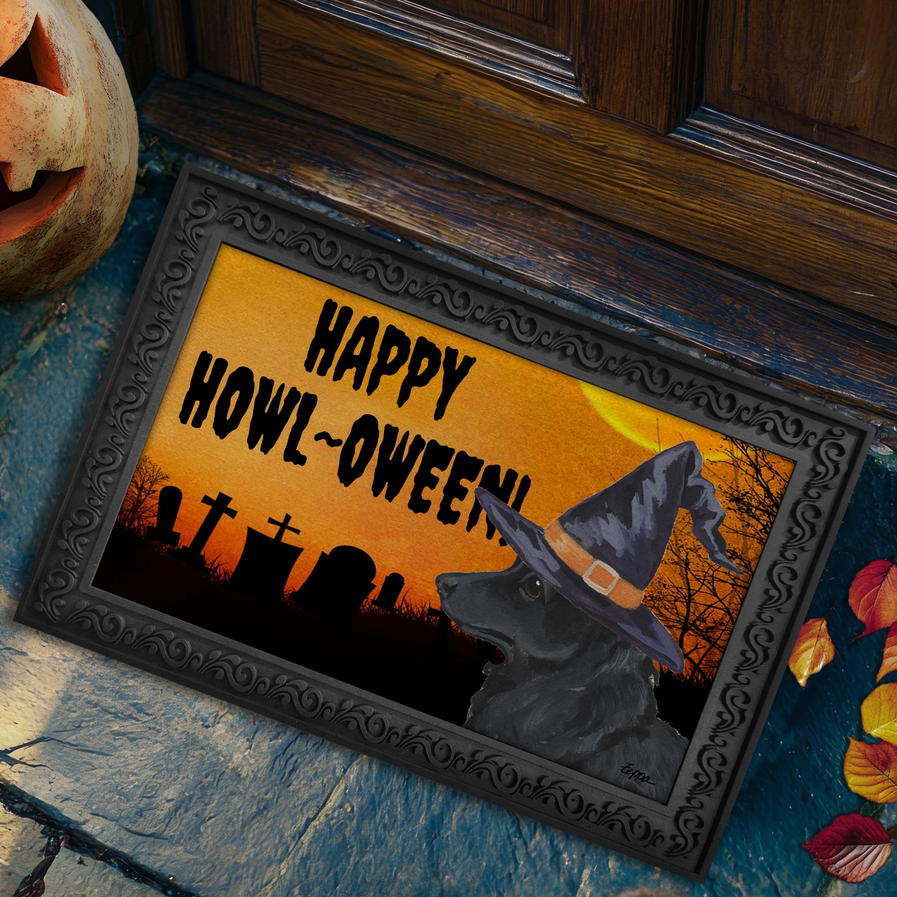Mudi in a witch's hat on a Happy Howl-oween doormat.