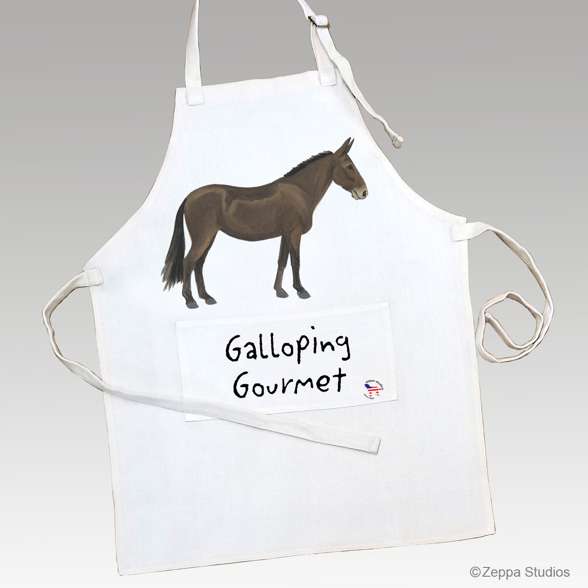 Mule illustration on a linen chef's apron with Galloping Gourmet printed on the front pocket.