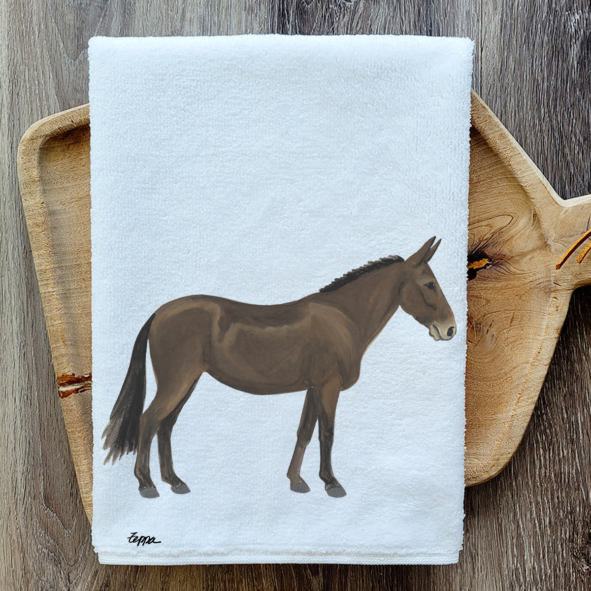 Mule on a folded kitchen towel resting on a wood serving board.