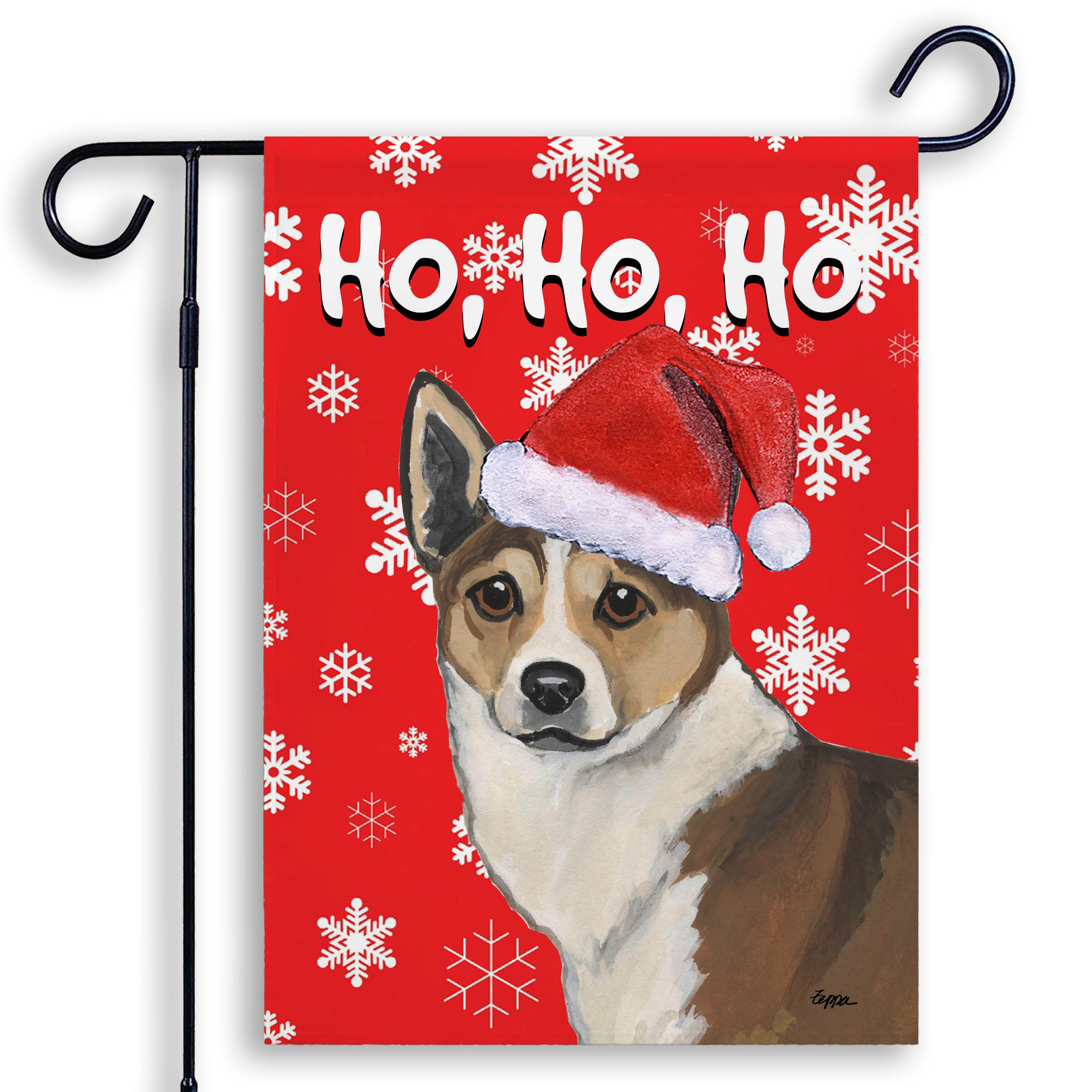 Holiday Garden Flag with a Norwegian Lundehund in a Santa hat on a red snowflake background.