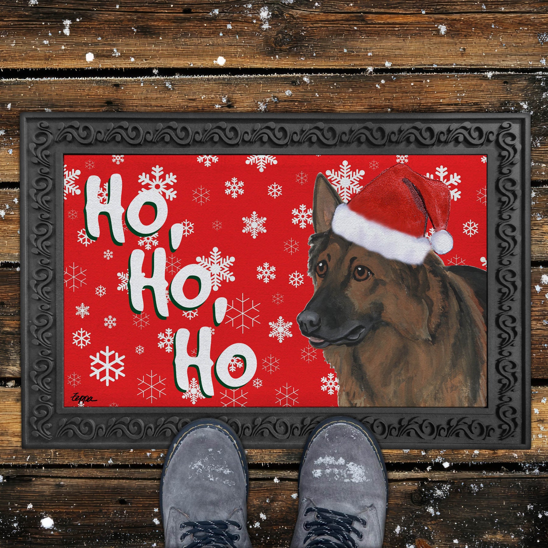 Christmas-themed door mat with a Shiloh Shepherd wearing a Santa hat and snowflakes on a red background.