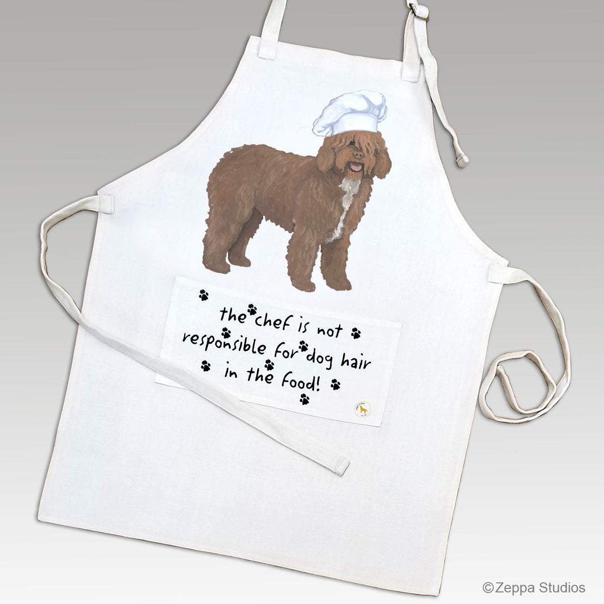 Spanish Water Dog in a chef hat design on a beige linen apron with funny text on the pocket.