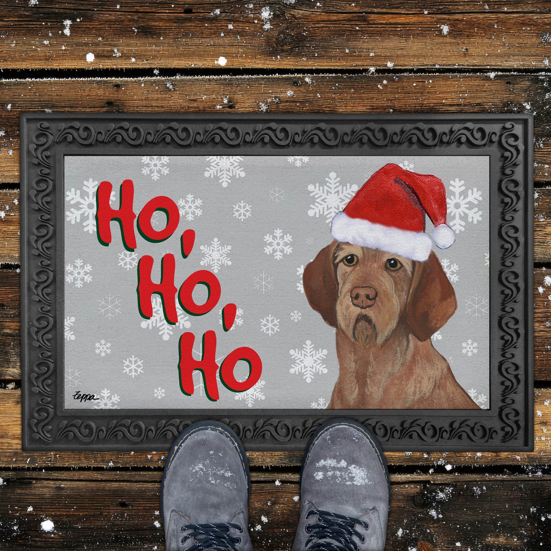 Christmas-themed door mat with a Wirehaired Vizsla wearing a Santa hat and snowflakes on a grey background.
